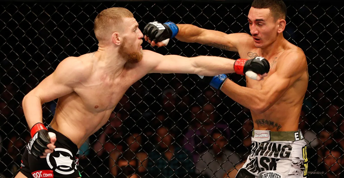 Conor McGregor vs. Max Holloway: O Dia em que ‘Notorious’ Venceu ‘Blessed’ em Boston e a Espera pela Revanche Épica no UFC 329
